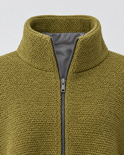 Close-up of the funnel collar, silver center zipper and soft grey lining